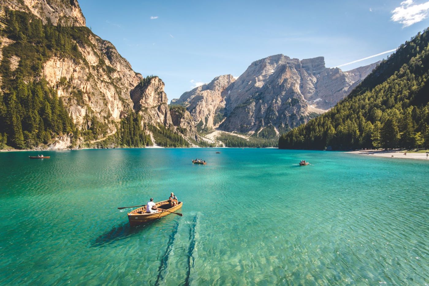 Rowing boats on a turquoise mountain lake